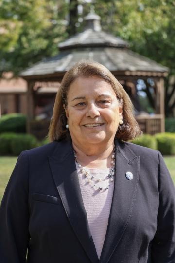 Sylvia McGeary standing in front of HFU's gazebo